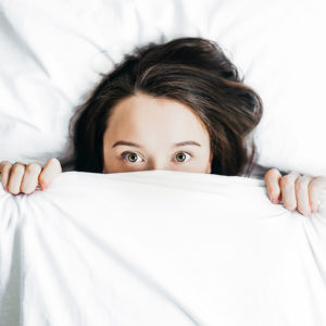 A woman under the sheets