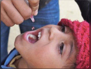 A young girl taking medicine